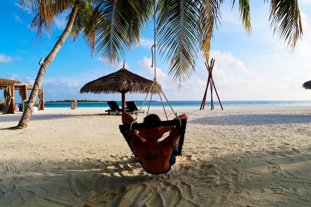 man relaxing in maldives island